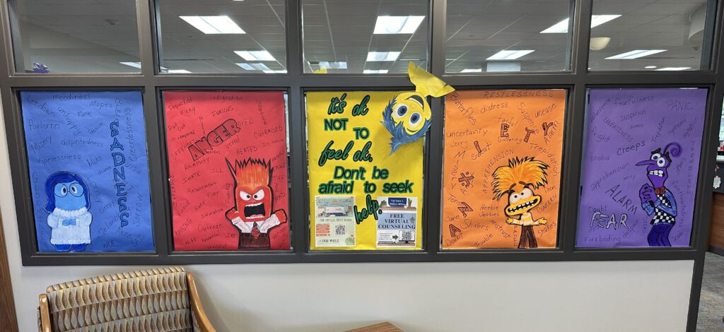 Windows decorated like Inside Out emotions in Thigpen Library.